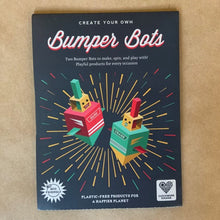 Load image into Gallery viewer, Two itsy-bitsy Bumper Bots to make, spin and play with!  Just pop out the pieces and fold together for a fun game of battling robots!  Perfect for a party bag or stocking filler, this simple and eco-friendly kit is made from one piece of recycled card.  Plastic-free for a happier planet, and no glue or scissors needed