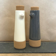 Load image into Gallery viewer, A white contemporary oil and balsamic vinegar dispenser bottle would look stylish in any kitchen. Made from pottery & cork