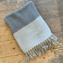 Load image into Gallery viewer, This cosy grey throw, made from recycled cotton, will add a nice detail to your sofa or chair.
