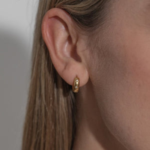 Crystal cosmic huggie earrings - gold