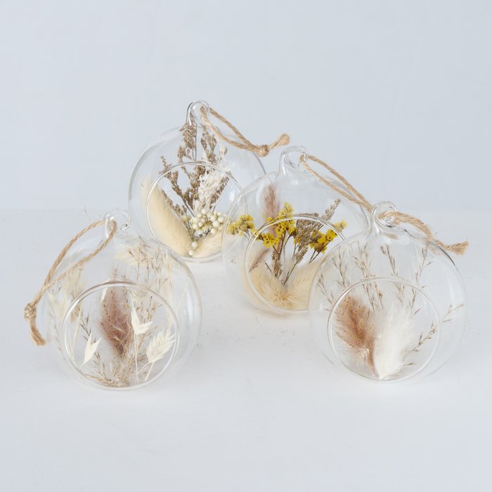 Glass baubles with grass/feathers