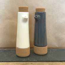 Load image into Gallery viewer, A white contemporary oil and balsamic vinegar dispenser bottle would look stylish in any kitchen.  Made from pottery &amp; cork
