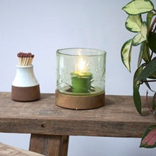 Load image into Gallery viewer, Beautiful hand-blown green tinted glass hurricane lamp with wooden base and etched detail.
