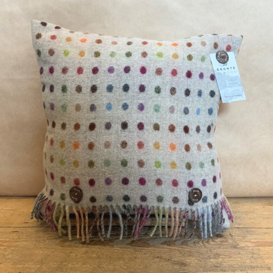 Make a statement with vibrant, eye-catching colour; this 100% Merino Lambswool feather filled cushion is covered in tasteful multi-coloured spots.  One of our best selling designs!