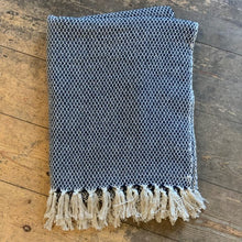 Load image into Gallery viewer, This cosy blue throw, made from recycled cotton, will add a nice detail to your sofa or chair.
