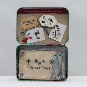 Flower pressing in a tin