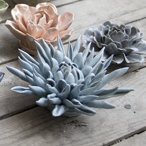 This beautiful ceramic flower is perfect for a decorative wall hanging or table top.