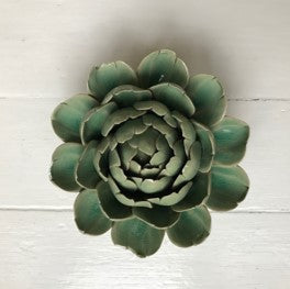 This beautiful ceramic flower is perfect for a decorative wall hanging or table top.